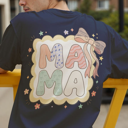Person wearing a navy blue t-shirt with 'MAMA' design on the back.