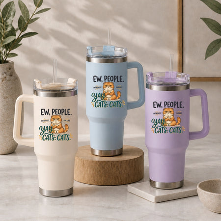 Three insulated travel tumblers with handles and straws in cream, light blue, and pastel purple, all customized with a matching funny grumpy cat introvert design.