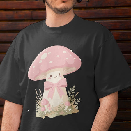 Person wearing a black t-shirt with a pink mushroom design.