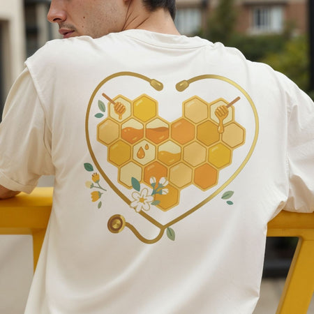 Person wearing a white t-shirt with a heart-shaped honeycomb design on the back.