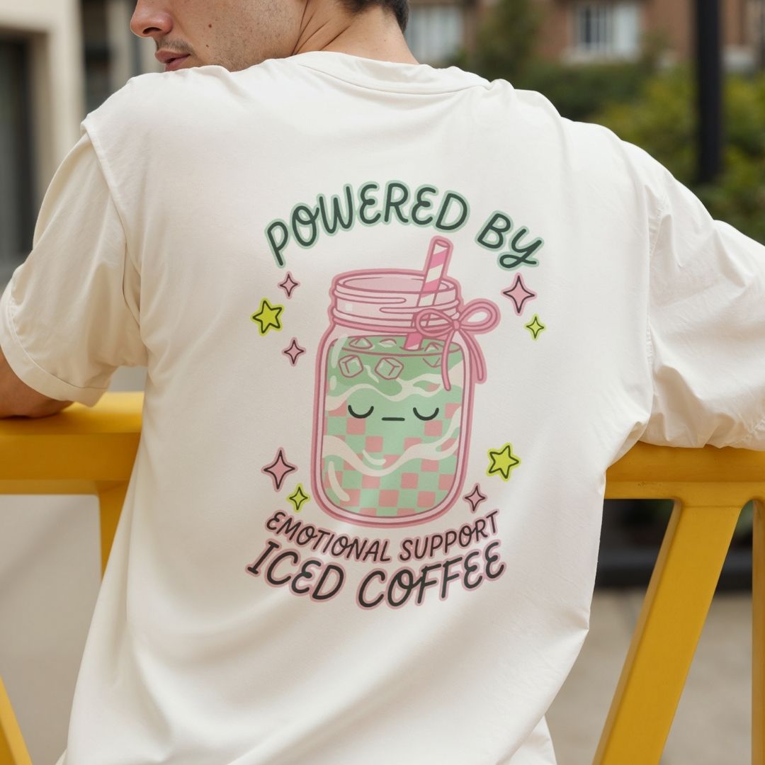 Person wearing a white t-shirt with a colorful design and text on the back.