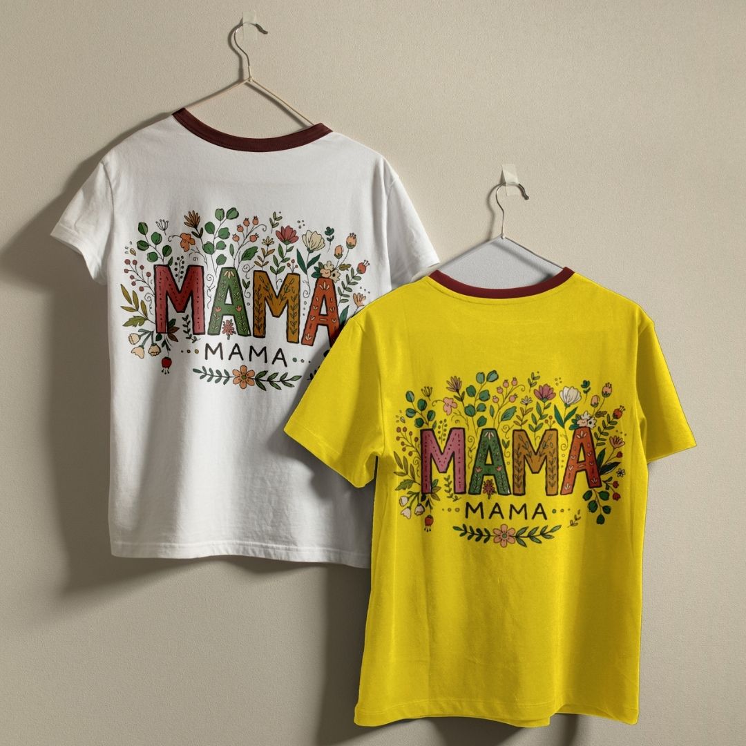 Two t-shirts, one white and one yellow, with 'MAMA' text and floral designs on a beige background.