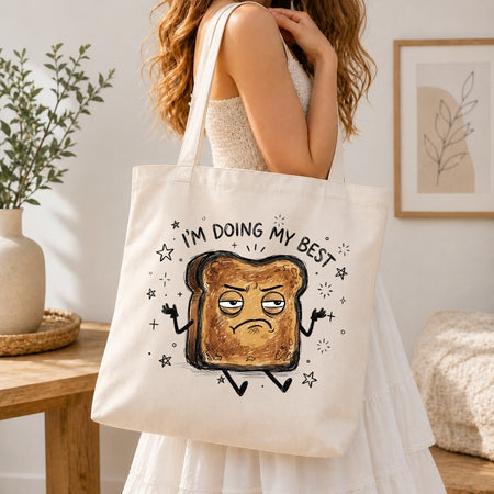 Person in a white dress carrying a canvas tote bag printed with the relatable burnt toast character graphic.
