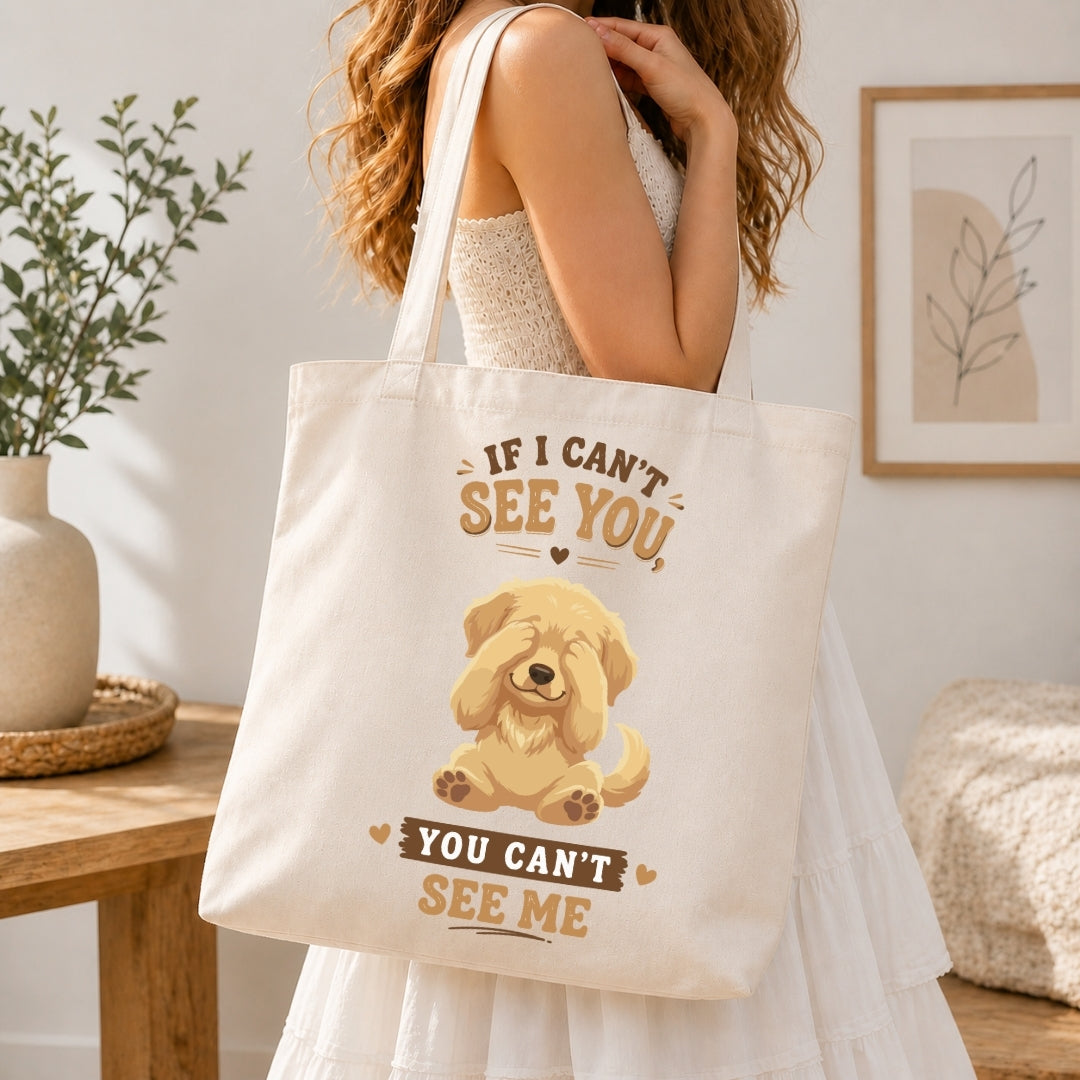 Back view of a person wearing a white t-shirt showcasing the peek-a-boo golden retriever puppy design and typography