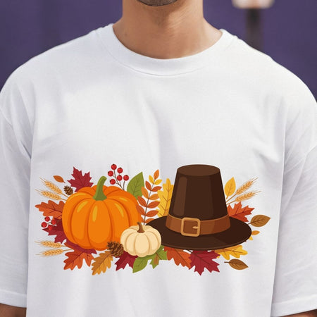 White t-shirt with a Thanksgiving-themed design featuring pumpkins and a pilgrim hat.