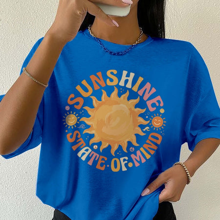 Person wearing a blue t-shirt with a sun graphic and 'Sunshine State of Mind' text.