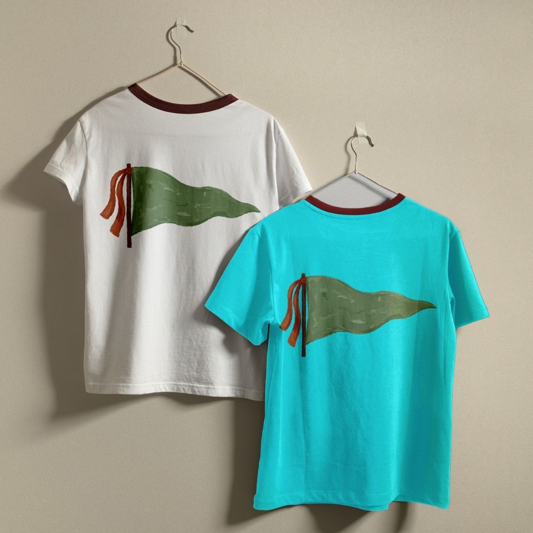Two t-shirts with a flag design on a beige background