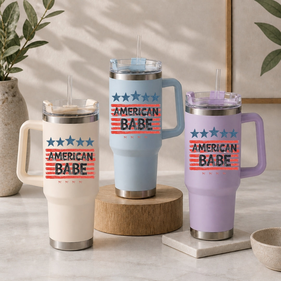 Three insulated travel mugs with 'American Babe' text on a neutral background