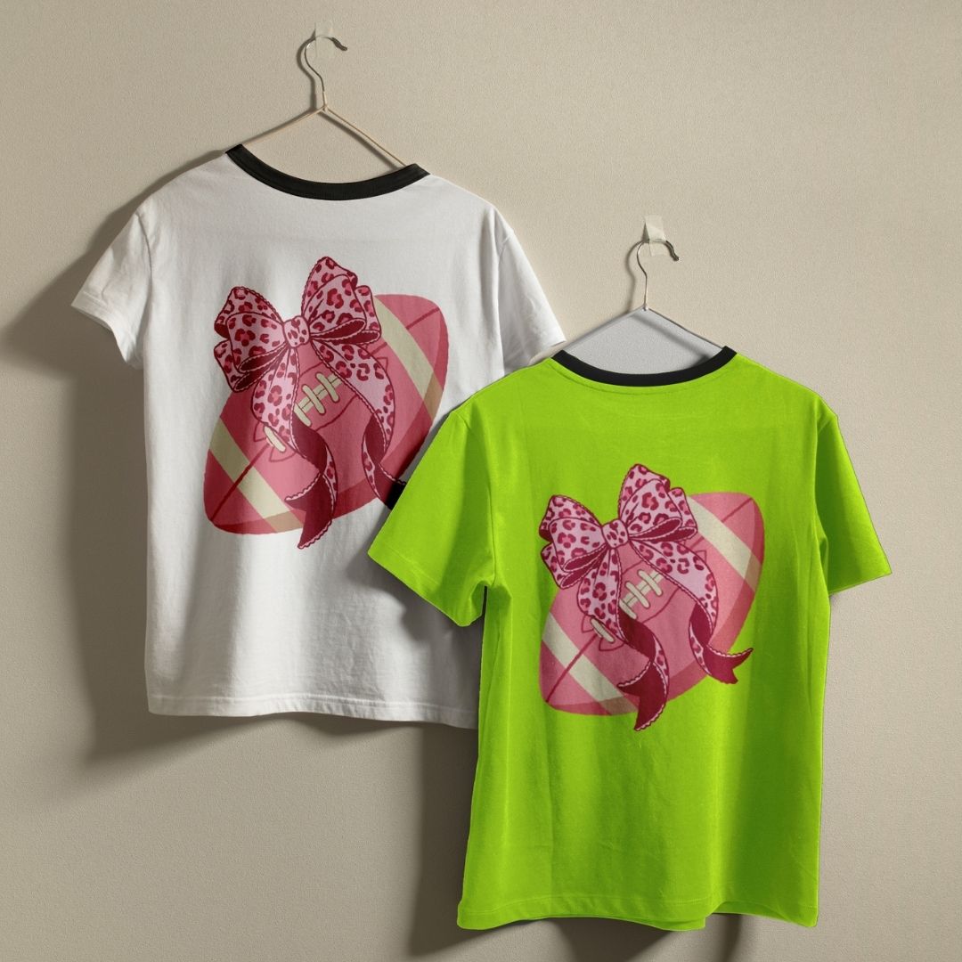 White and green t-shirts with pink bow design on a beige background