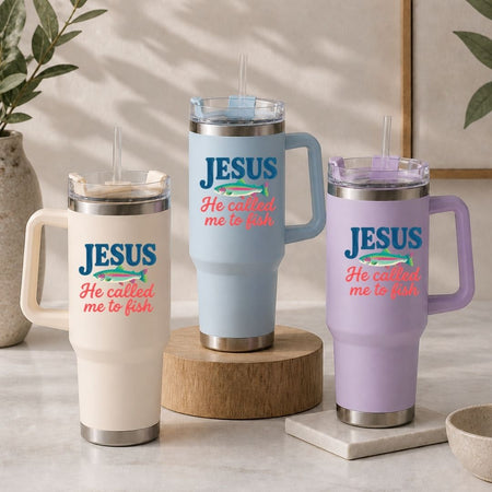 Three insulated travel tumblers in cream, light blue, and lavender purple arranged on a table, all showcasing the retro faith design.