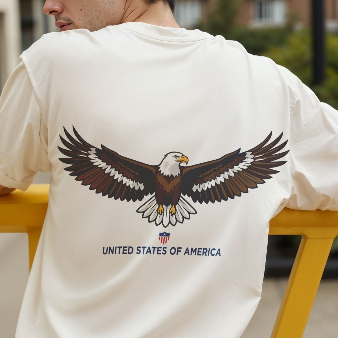 Person wearing a white t-shirt with an eagle graphic and 'United States of America' text.