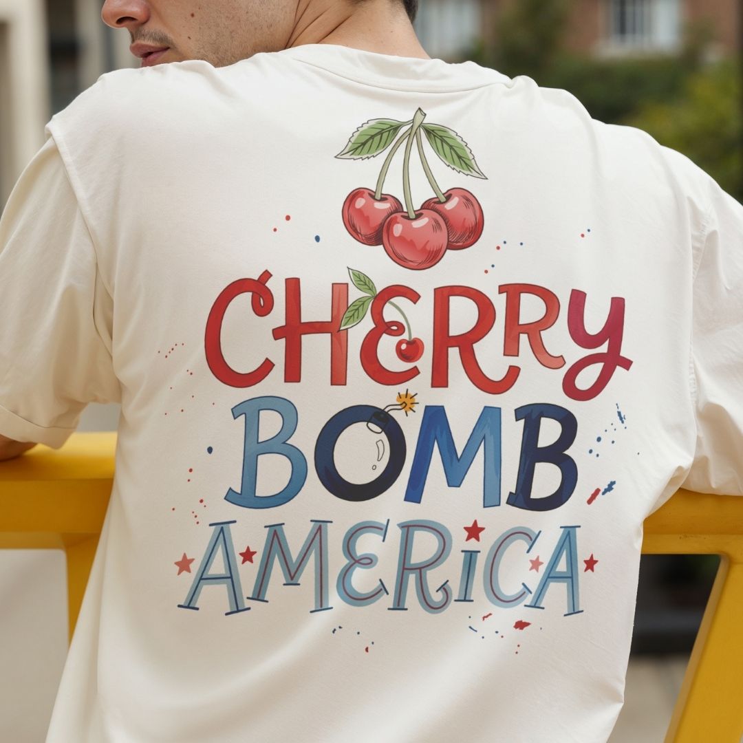 T-shirt with 'Cherry Bomb America' design on the back, featuring cherries and colorful text.