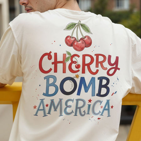 T-shirt with 'Cherry Bomb America' design on the back, featuring cherries and colorful text.