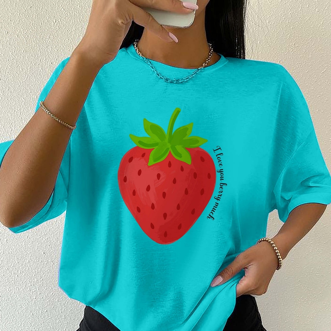 Person wearing a turquoise t-shirt with a strawberry graphic and text.