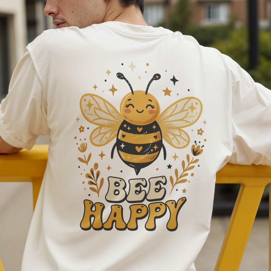 Person wearing a white t-shirt with a bee graphic and 'Bee Happy' text.