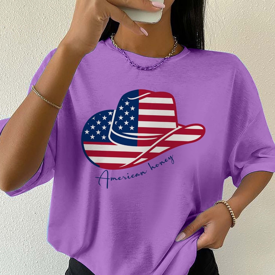 Person wearing a purple t-shirt with an American flag design and 'American honey' text.