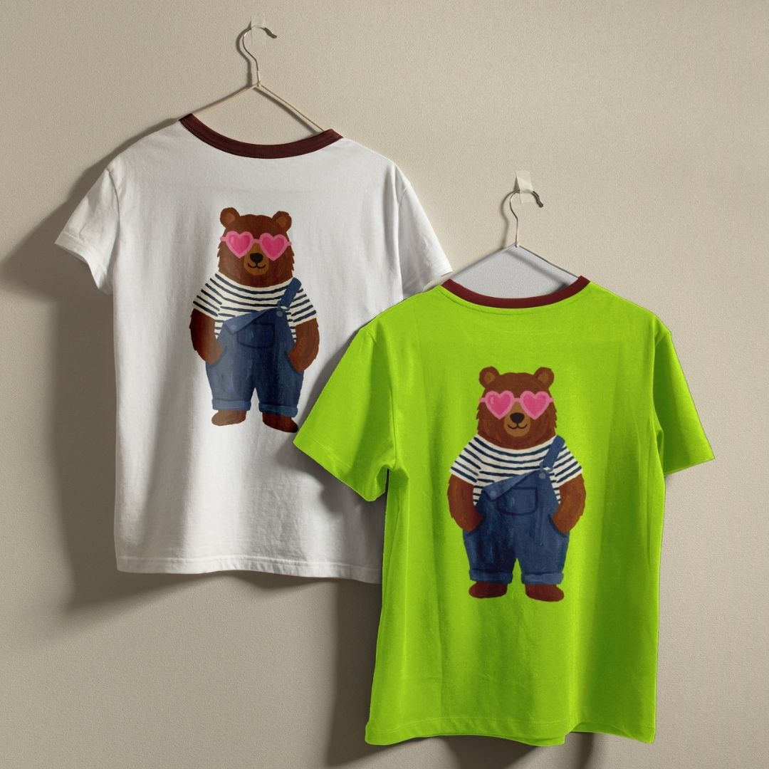 Two t-shirts with a bear design on a beige background