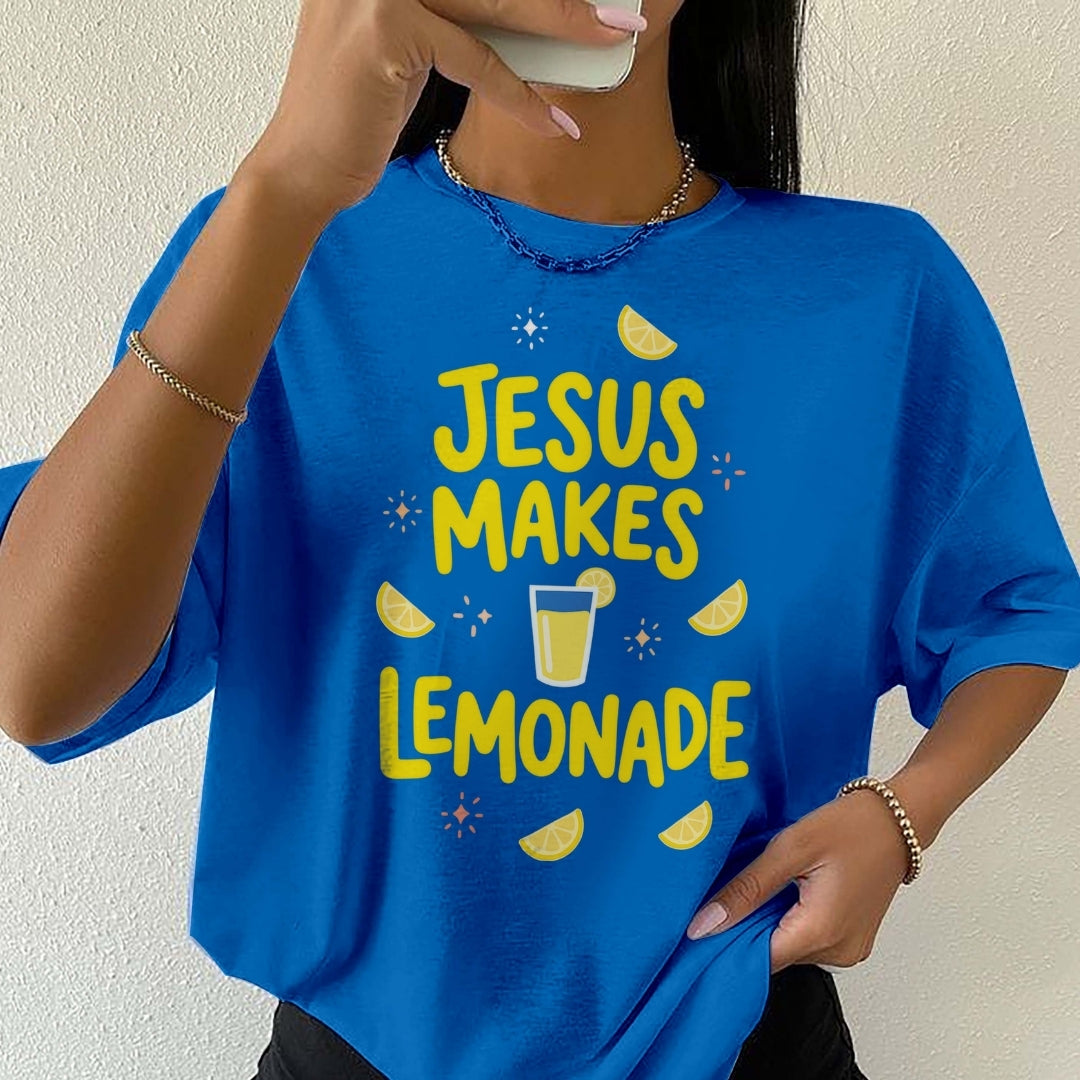 Person wearing a blue t-shirt with 'Jesus Makes Lemonade' text and graphics.