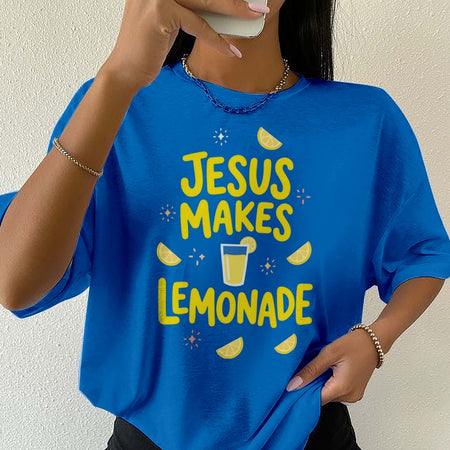 Person wearing a blue t-shirt with 'Jesus Makes Lemonade' text and graphics.