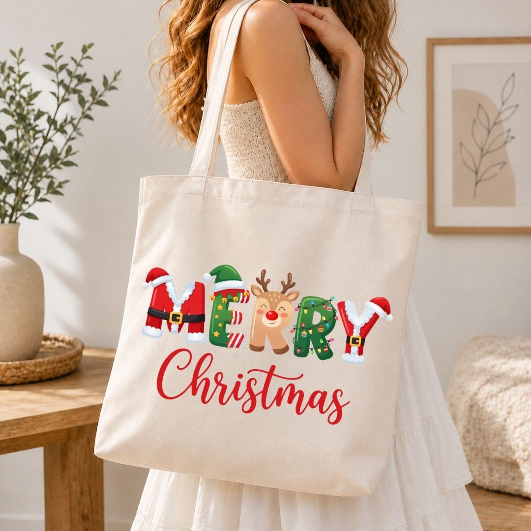 Woman holding a canvas tote bag printed with a festive "MERRY Christmas" holiday graphic.