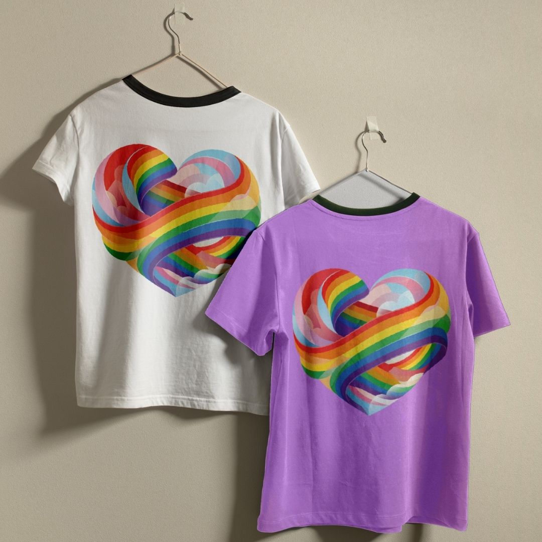 Two t-shirts with a rainbow heart design on a beige background