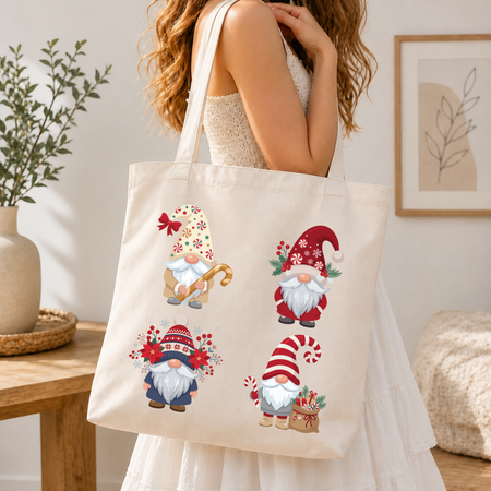 Woman holding a canvas tote bag printed with a festive Christmas gnomes holiday graphic.