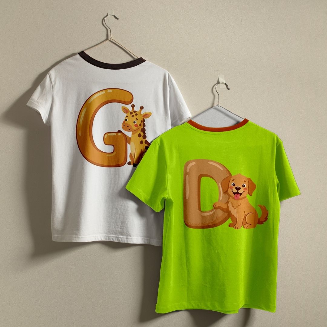 Two t-shirts hanging side-by-side—a white shirt printed with the letter G and a giraffe, and a neon green shirt printed with the letter D and a happy puppy.