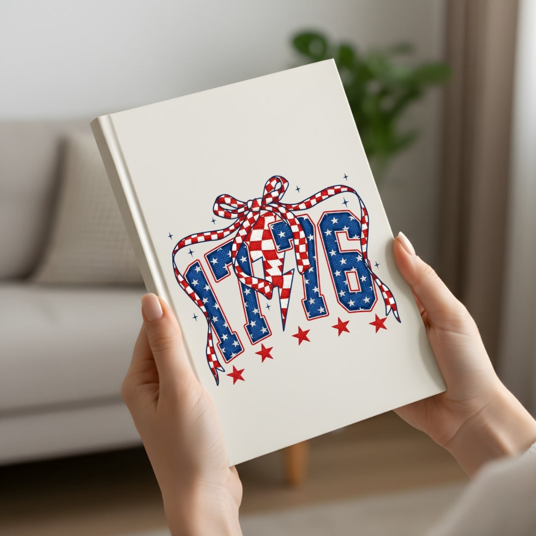 Book with 'Pride' design featuring stars and a ribbon held by hands in a home setting.