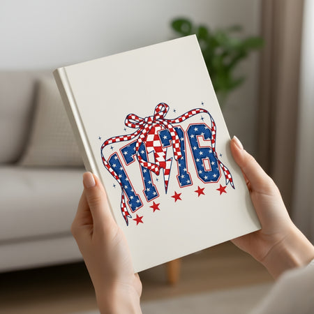 Book with 'Pride' design featuring stars and a ribbon held by hands in a home setting.