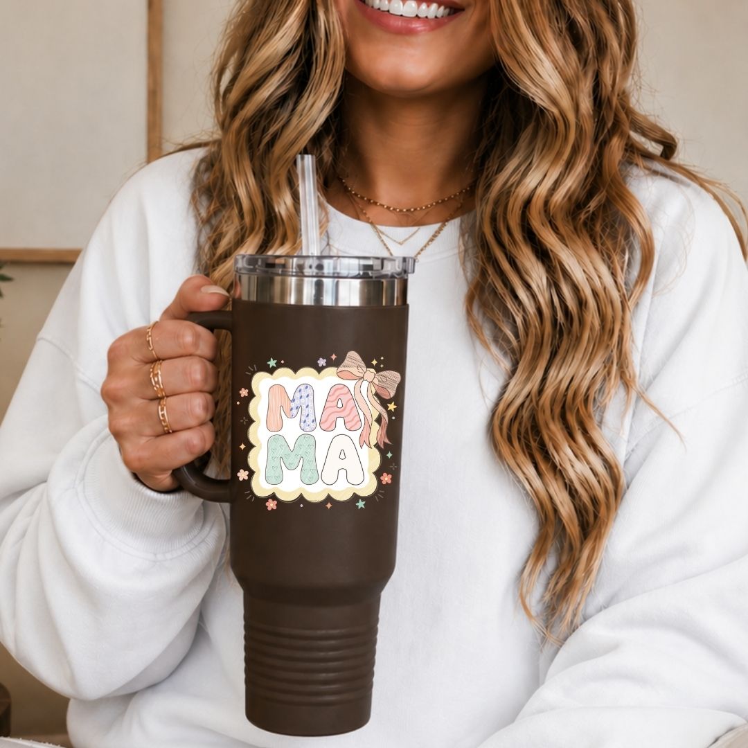 Person holding a brown mug with 'MAMA' design, smiling.