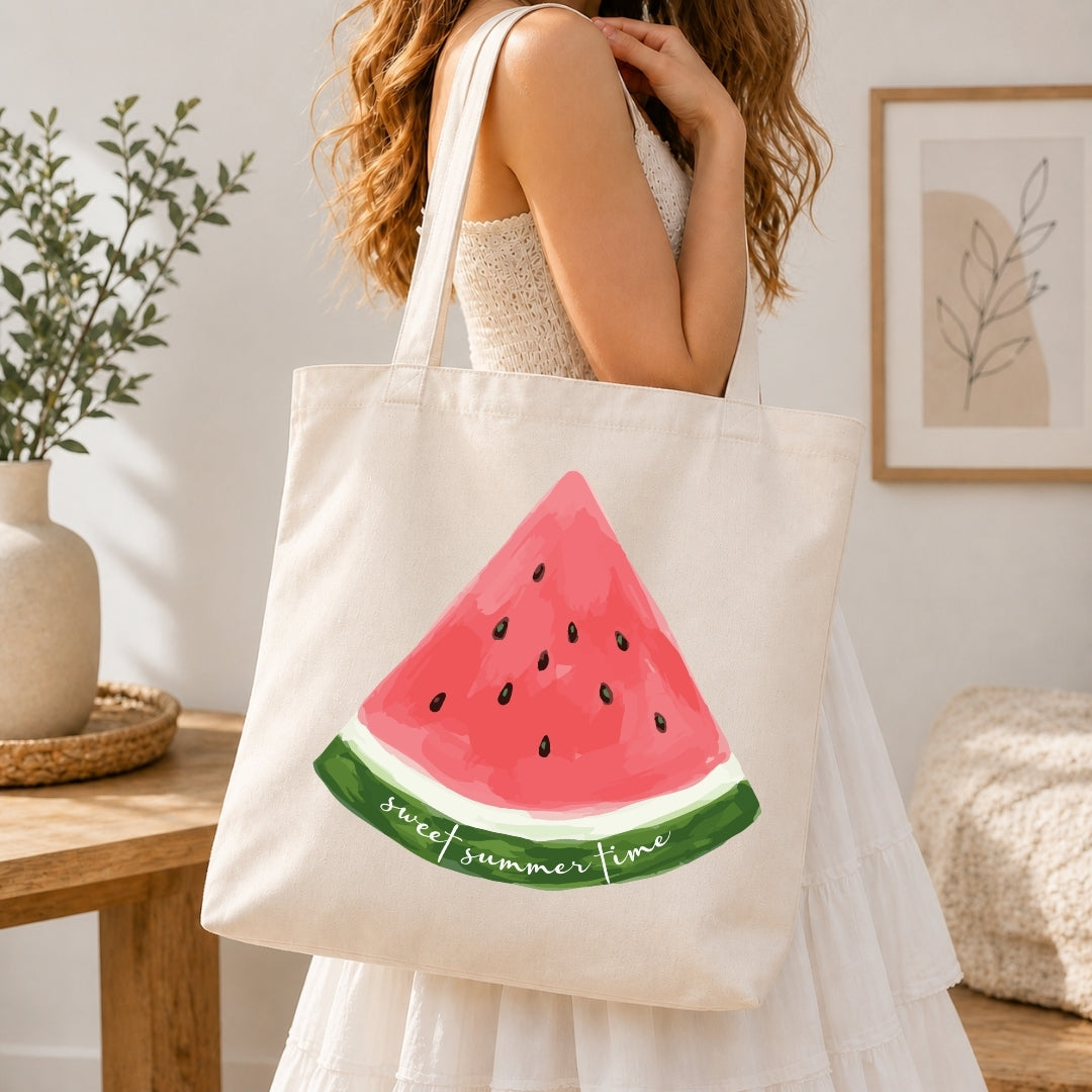 Tote bag with watermelon design held by a person in a home setting