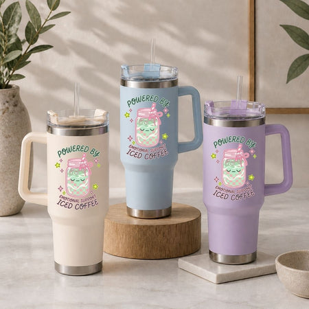 Three insulated travel mugs with colorful designs and text on a neutral background.