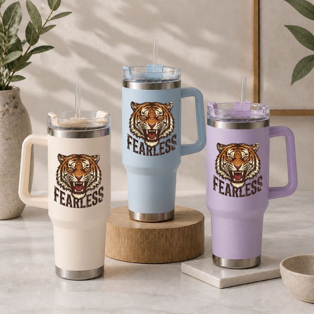 Three insulated mugs with tiger design and 'FEARLESS' text on a neutral background