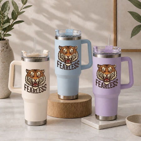 Three insulated mugs with tiger design and 'FEARLESS' text on a neutral background