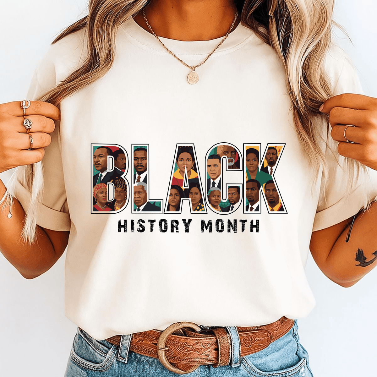 Person wearing a white t-shirt with 'BLACK HISTORY MONTH' design featuring various faces.