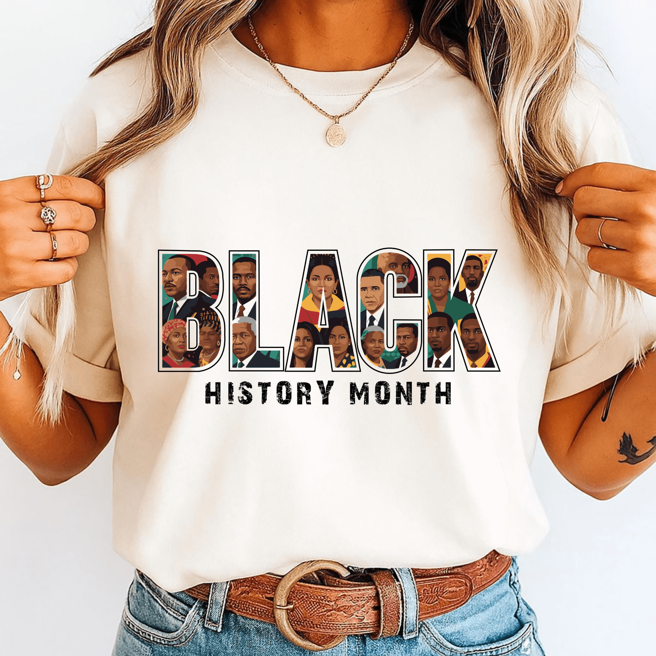 Person wearing a white t-shirt with 'BLACK HISTORY MONTH' design featuring various faces.