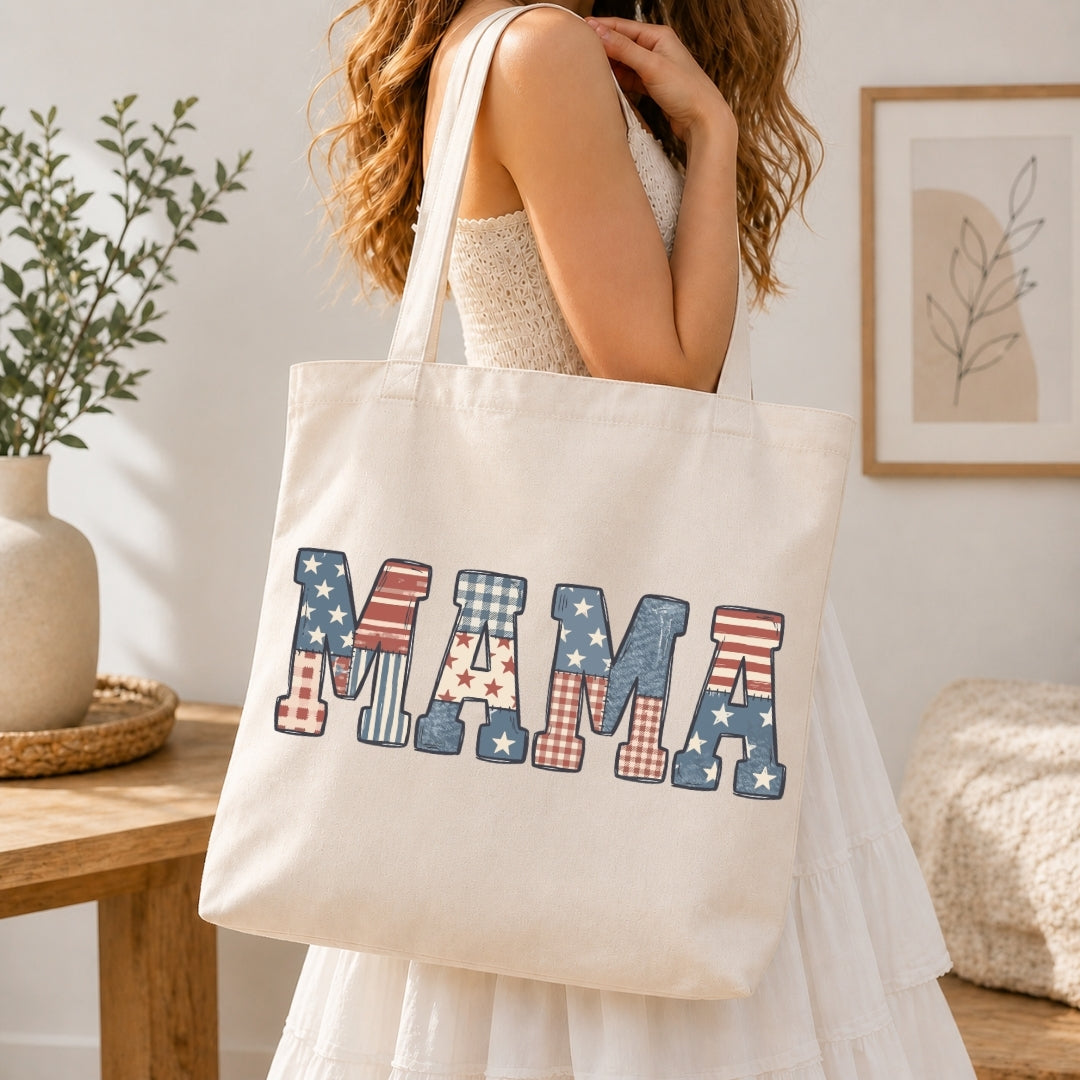 Person holding a tote bag with 'MAMA' in American flag pattern