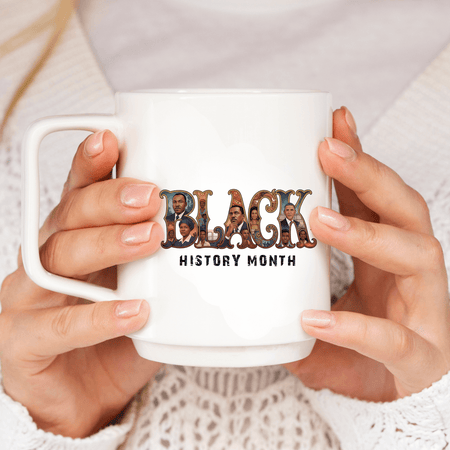 White mug with 'Black History Month' design held by hands against a neutral background