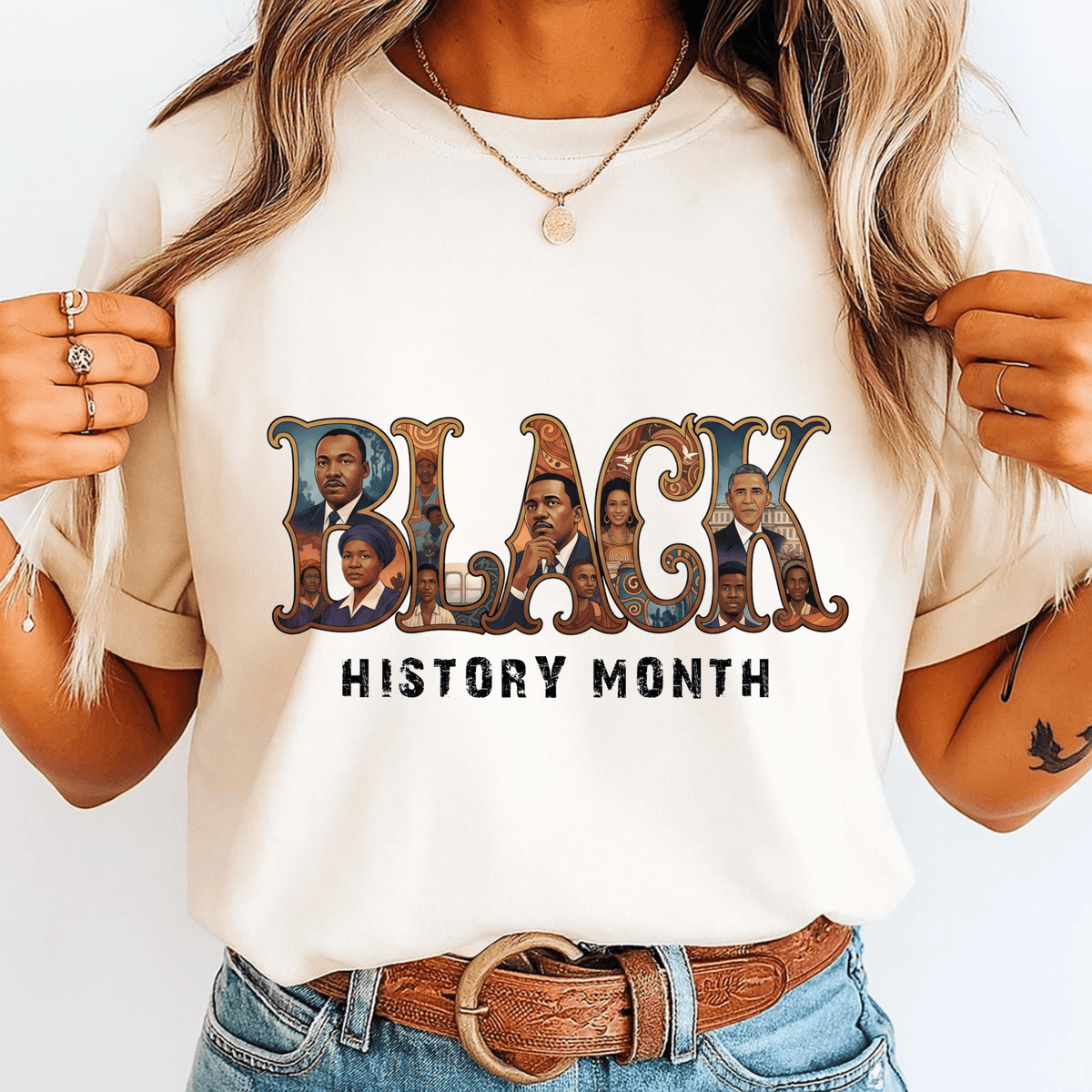 Person wearing a white t-shirt with 'BLACK HISTORY MONTH' design featuring images of influential figures.