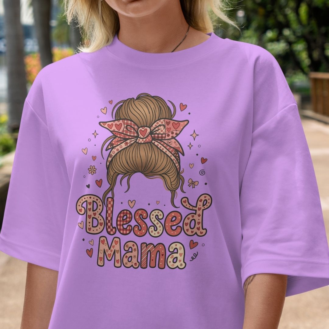 Person wearing a purple t-shirt with 'Blessed Mama' design outdoors.