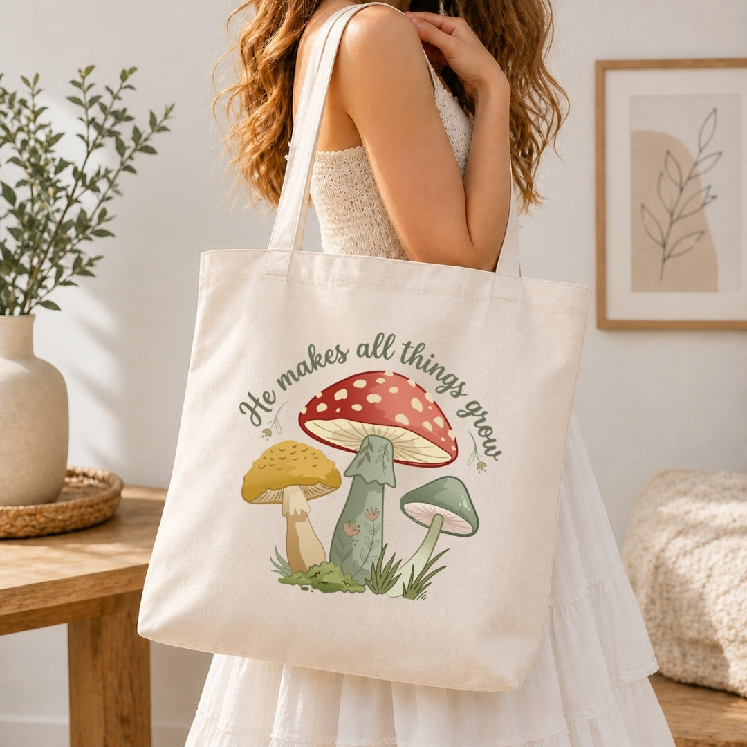 Person holding a tote bag with mushroom design and text in a home setting