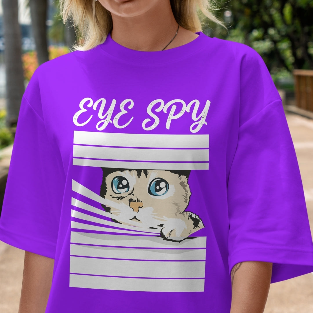 Person wearing a purple t-shirt with a cat graphic and 'EYE SPY' text.