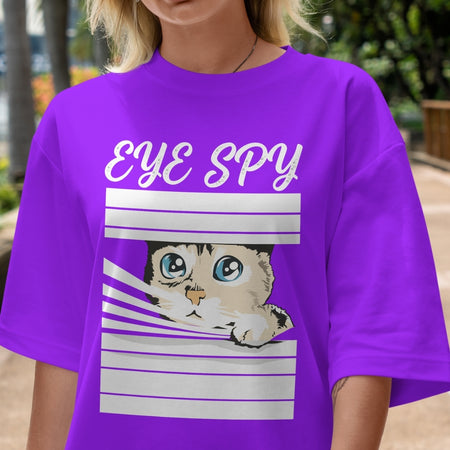Person wearing a purple t-shirt with a cat graphic and 'EYE SPY' text.