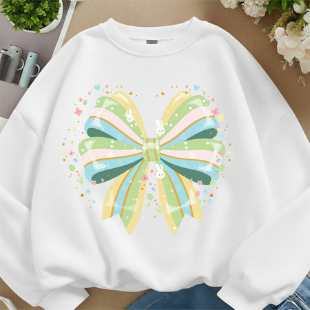 White sweatshirt with a colorful butterfly design on a neutral background