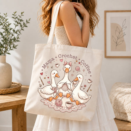 Person holding a tote bag with a design of ducks and text in a home setting
