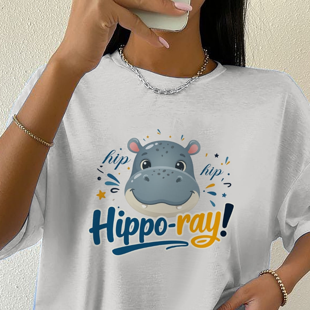 Person wearing a white t-shirt with a hippo graphic and 'hippoo-ray!' text.