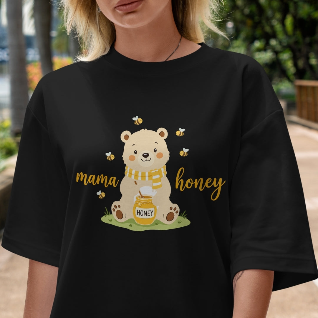 Person wearing a black t-shirt with a bear graphic and 'mama honey' text.