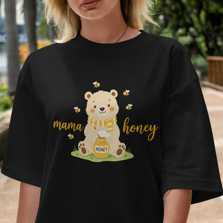 Person wearing a black t-shirt with a bear graphic and 'mama honey' text.