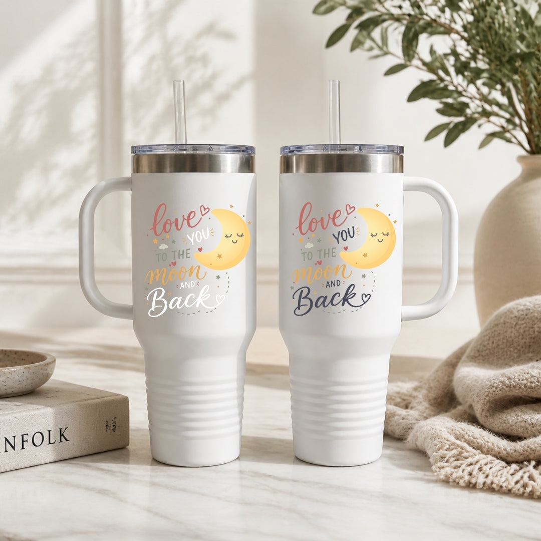 Two white tumblers with a design and text on a neutral background