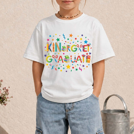Child wearing a white t-shirt with 'Kindergarten Graduate' text and colorful design.